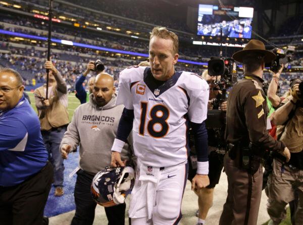 Denver Broncos quarterback Peyton Manning (18) walks off the field in Indianapolis, Ind., on Oct. 20, 2013. (Michael Conroy/AP Photo)