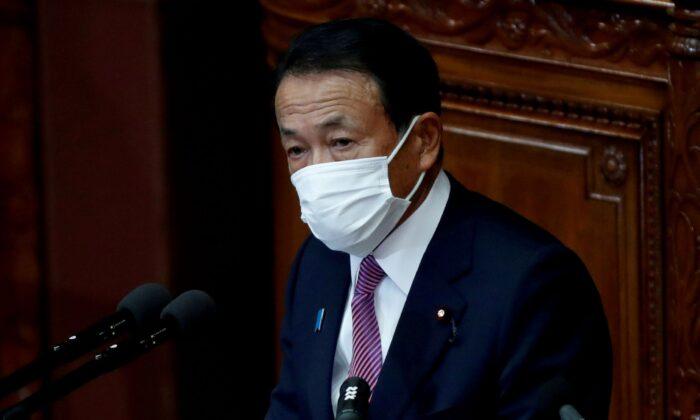 Japan’s Aso Urges Joint Monetary, Fiscal Policies to Spur Inflation