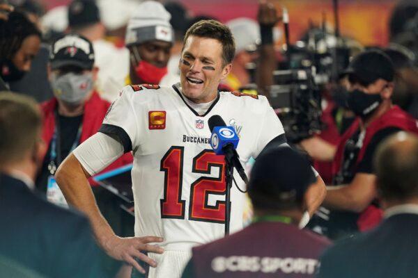 Tampa Bay Buccaneers quarterback Tom Brady (12) is interviewed on the field in Tampa, Fla., on Feb. 7, 2021. (Steve Luciano/AP Photo)