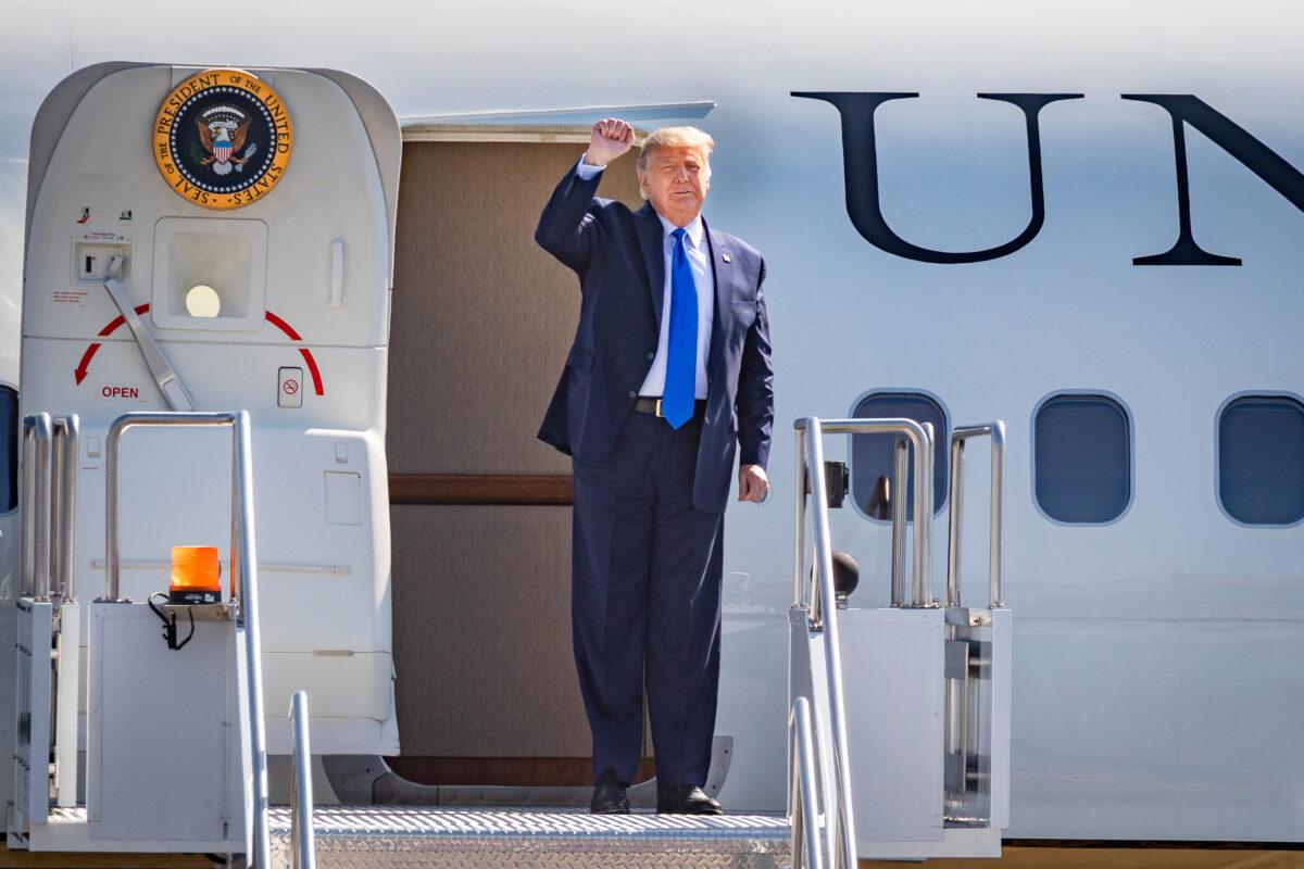 Then-President Donald Trump greets cheering supporters at John Wayne Airport in Santa Ana, Calif., on October 18, 2020. (John Fredricks/The Epoch Times)