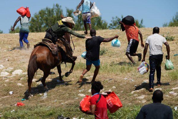 A United States Border Patrol agent on horseback tries to stop illegal immigrants from entering the United States, in Del Rio, Texas, on Sept. 19, 2021. (Paul Ratje/AFP via Getty Images)