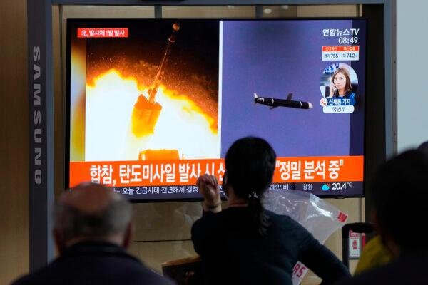 People watch a TV showing a file image of a North Korea missile launch during a news program at the Seoul Railway Station in Seoul, South Korea, on Sept. 28, 2021. (AP Photo/Ahn Young-joon)