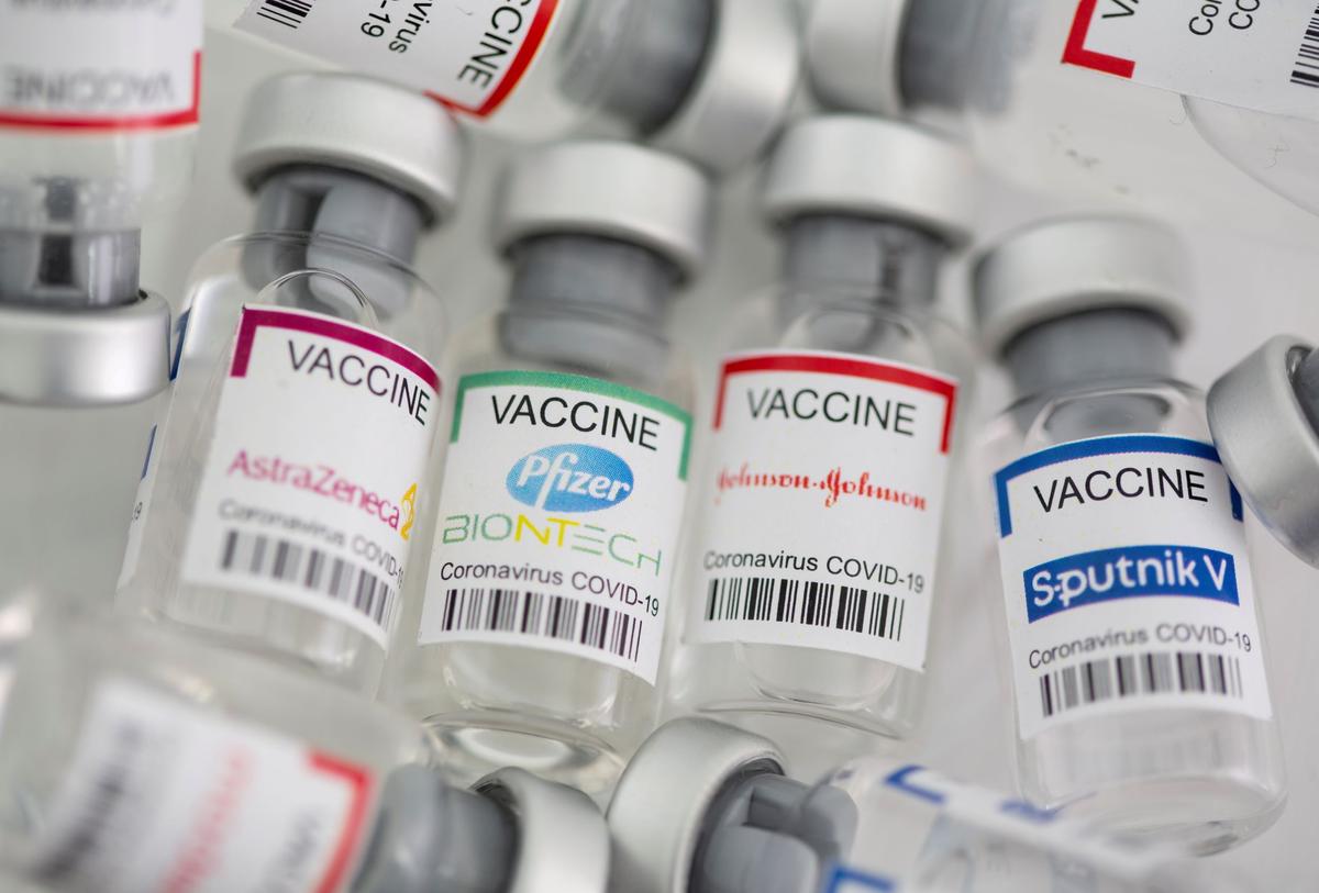  Vials labeled "AstraZeneca, Pfizer-BioNTech, Johnson & Johnson, and Sputnik V COVID-19 vaccine." Photo taken May 2, 2021. (Dado Ruvic/Illustration/Reuters)
