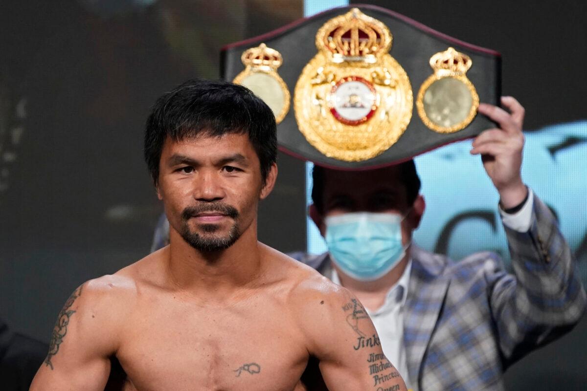 Manny Pacquiao poses for photographers during a weigh-in in Las Vegas, Calif., on Aug. 20, 2021. (John Locher/AP Photo)