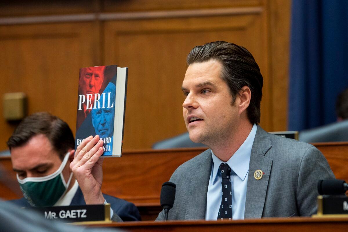 Rep. Matt Gaetz (R-Fla.) holds up a copy of "Peril" during a congressional hearing at the U.S. Capitol in Washington, on Sept. 29, 2021. (Rod Lamkey/Pool/Getty Images)