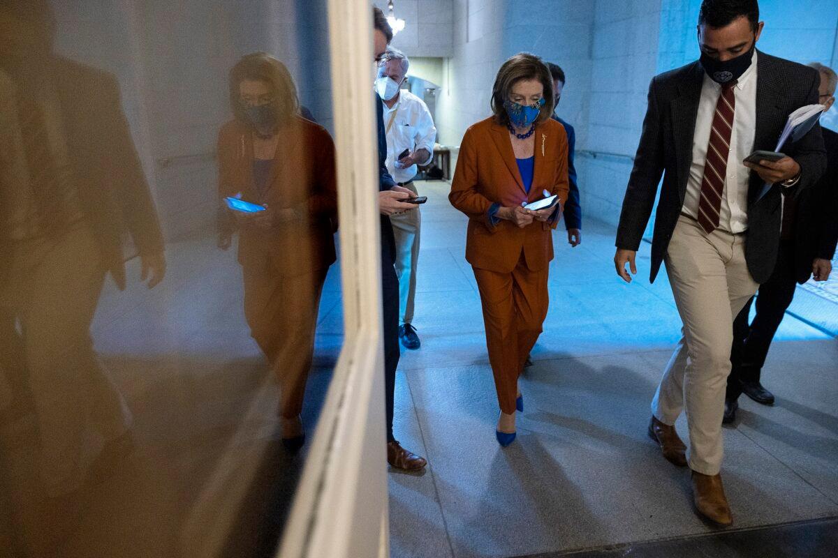 House Speaker Nancy Pelosi (D-Calif.) departs a House Democratic whip meeting in the basement of the U.S. Capitol in Washington on Sept. 29, 2021. (Chip Somodevilla/Getty Images)