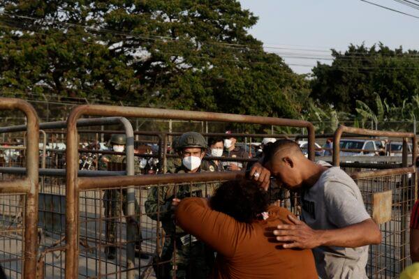 Relatives of prisoners await news outside the Litoral Penitentiary in Guayaquil, Ecuador, on Sept. 29, 2021. (Angel DeJesus/AP Photo)