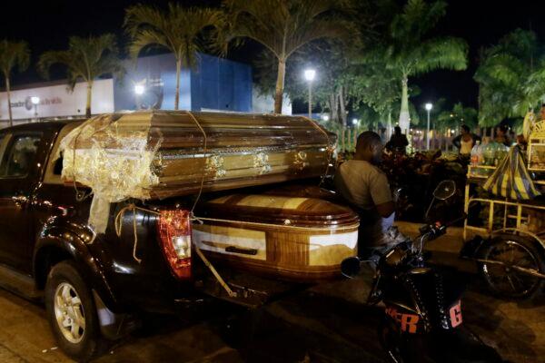 Coffins for the bodies of inmates killed in a riot at the Litoral penitentiary sit on a truck out side the morgue in Guayaquil, Ecuador, on Sept. 29, 2021. (Angel DeJesus/AP Photo)