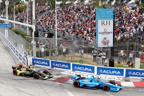 IndyCar series points leader Alex Palou (10) takes Turn 1 with Colton Herta (26) during an auto race at Grand Prix of Long Beach, in Long Beach, Calif., on Sept. 26, 2021. (Alex Gallardo/AP Photo)