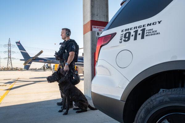 Los Angeles Police Department K-9 officers prepare for an operation in Los Angeles on Dec. 13, 2018. (John Fredricks/The Epoch Times)