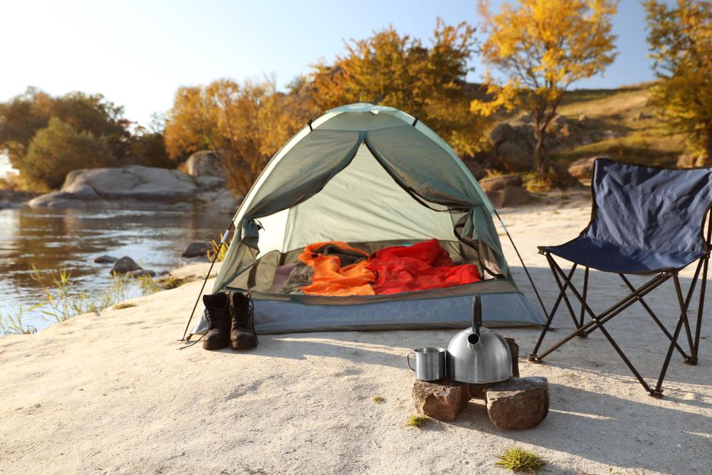 Outdoor stores are putting their best camping gear on sale. (New Africa/Shutterstock)