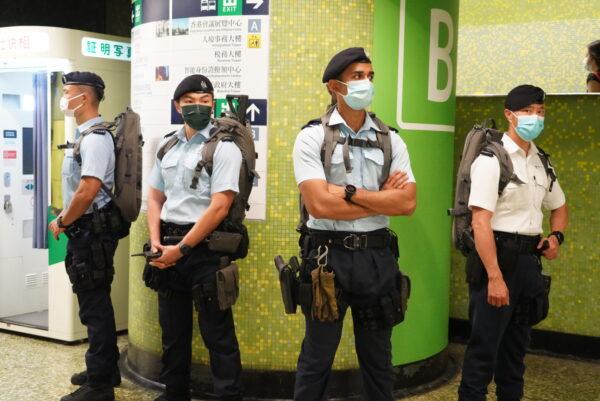 Counterterrorism police guarded at a metro station in Hong Kong on October 1, 2021. (Sung Pi-lung/The Epoch Times)