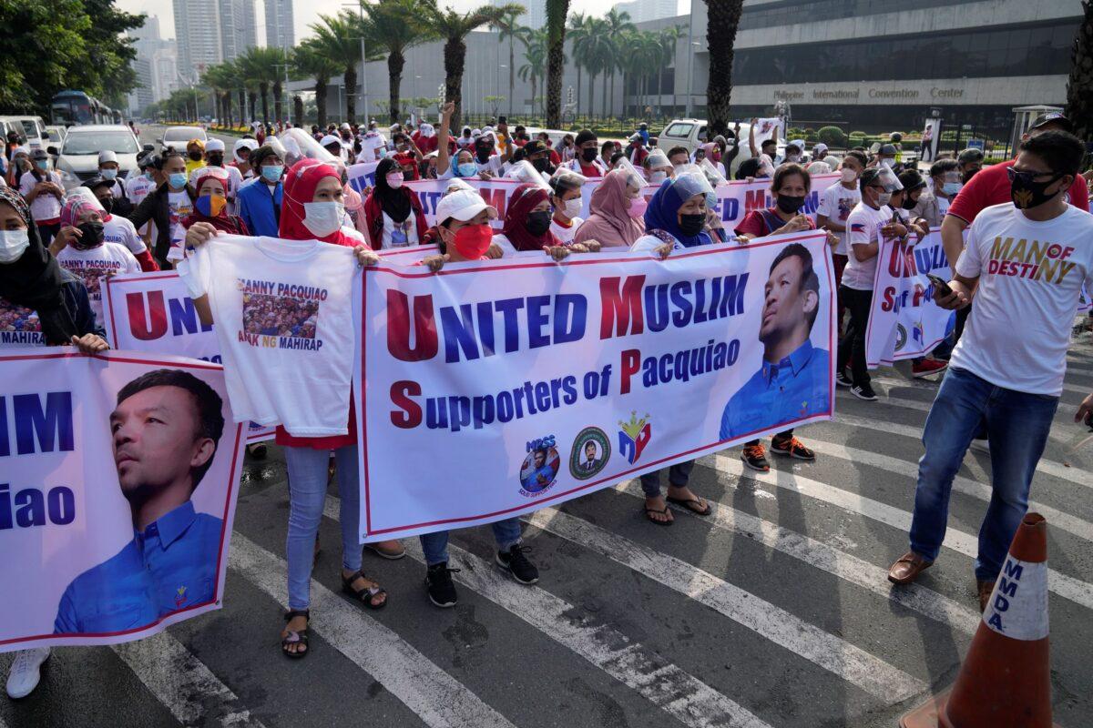 Supporters of retired Filipino boxing star and senator Manny Pacquiao gather before the Commission on Elections in Manila, Philippines on Oct. 1, 2021. (Aaron Favila/Photo via AP)