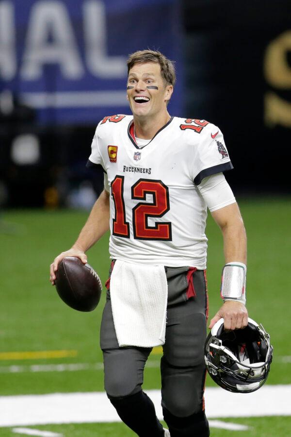 Tampa Bay Buccaneers quarterback Tom Brady smiles after an NFL divisional round playoff football game against the New Orleans Saints in New Orleans, La., on Jan. 17, 2021. (Brett Duke/AP Photo)