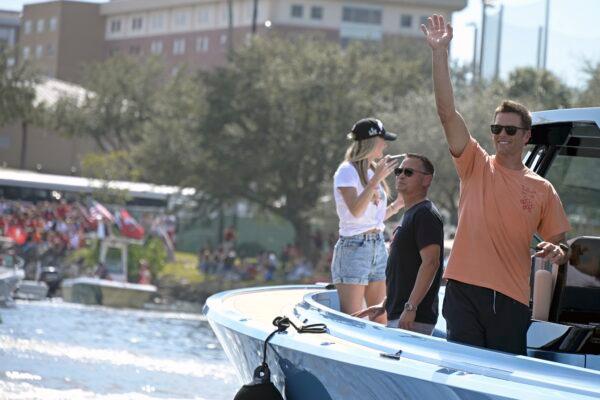 Tampa Bay Buccaneers NFL football quarterback Tom Brady waves to fans as he celebrates their Super Bowl 55 victory over the Kansas City Chiefs with a boat parade in Tampa, Fla., on Feb. 10, 2021. (Phelan Ebenhack/AP Photo)
