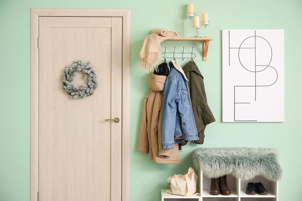 For form and function, install beautiful wall hooks to hang bulkier coats. (Pixel-Shot/Shutterstock)