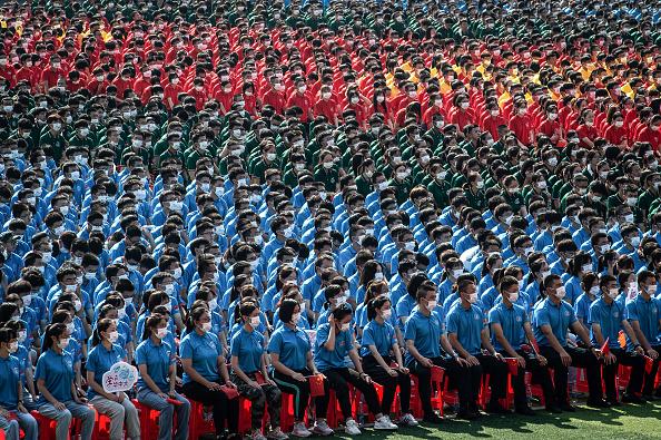 University students attend an opening ceremony of the new semester in Wuhan in China's central Hubei Province on Sept. 10, 2021. (STR/AFP via Getty Images)