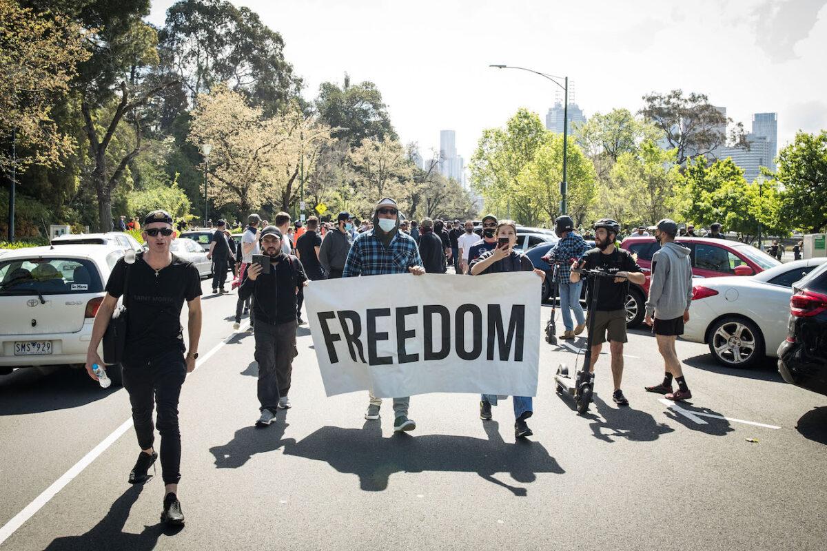 Protesters march at the Botanical Gardens in Melbourne, Australia, on Oct. 2, 2021. (Darrian Traynor/Getty Images)