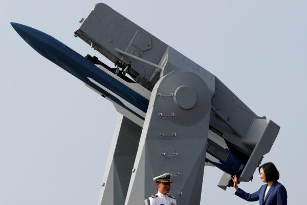 Taiwan's President Tsai Ing-wen waves to the media aboard the PFG-1112 Ming Chuan, a Perry-class guided missile frigate, after a commissioning ceremony at Kaohsiung's Zuoying naval base in Taiwan on Nov. 8, 2018. (Reuters/ Tyrone Siu)