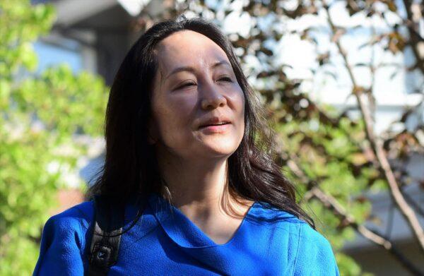 Huawei CFO Meng Wanzhou leaves her Vancouver home to attend her extradition hearing in the British Columbia Supreme Court in Vancouver, Canada, on Aug. 4, 2021. (Don Mackinnon/AFP via Getty Images)