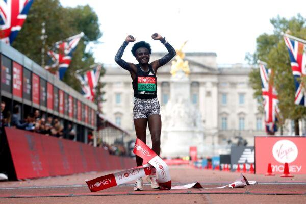 Kenya's Joyciline Jepkosgei celebrates winning the elite women's race at the London Marathon in London, Britain, on Oct. 3, 2021. (Matthew Childs/Reuters)