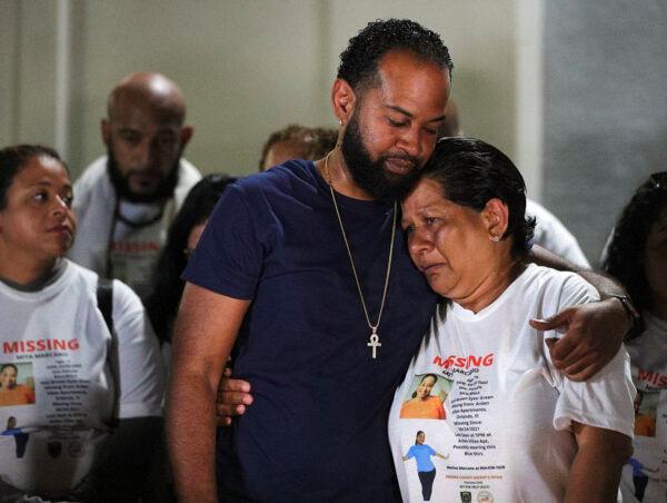 Miya Marcano's family, her father Marlon Marcano (left C) hosts a candlelight vigil at Arden Villas in Orlando, Fla., on Oct. 1, 2021. (Chasity Maynard/Orlando Sentinel via AP)