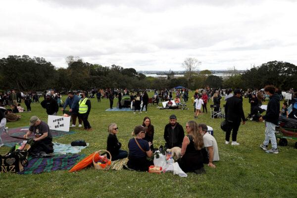 People gather at the Auckland Domain for a peaceful protest in Auckland, New Zealand, on Oct. 2, 2021. (Phil Walter/Getty Images)