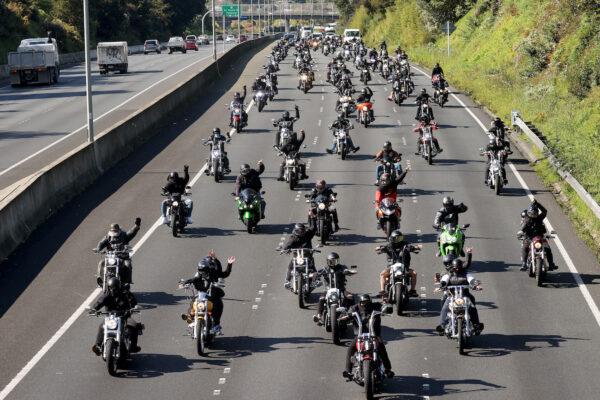 A procession of motorbikes travels along the Southern Motorway towards the Auckland Domain for a peaceful protest against government tyranny in Auckland, New Zealand, on Oct. 2, 2021. (Phil Walter/Getty Images)