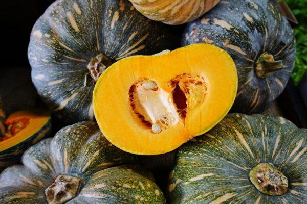 Kabocha squash, also sometimes called Japanese pumpkins, have dark green skin and bright orange insides with an earthy flavor. (EQRoy/shutterstock)