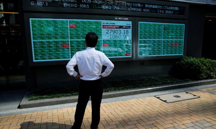 Asian Shares Slip as Evergrande, Inflation Worries Sap Positive Mood