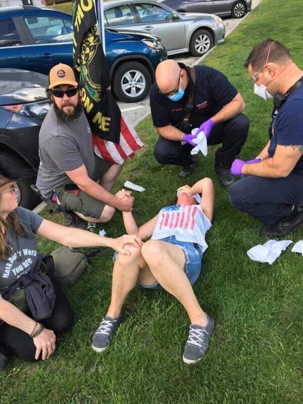 Karen 'Kay Sea' Skau is attended by paramedics after being assaulted at a Vermont Liberty rally at the Vermont State House on May 15, 2021. (Courtesy of Karen Skau)