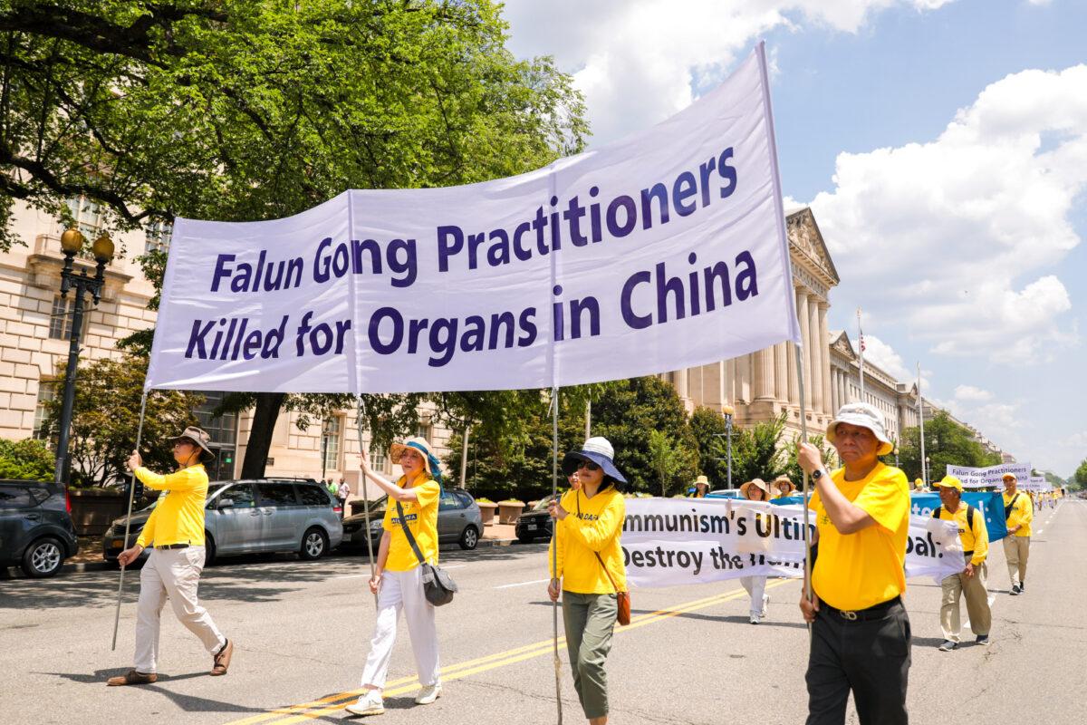Falun Gong practitioners take part in a parade marking the 22nd anniversary of the start of the Chinese regime’s persecution of Falun Gong, in Washington on July 16, 2021. (Samira Bouaou/The Epoch Times)