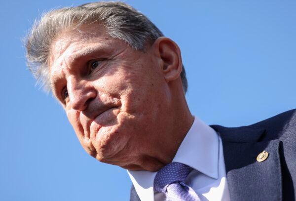 Sen. Joe Manchin (D-W.Va.) speaks to reporters in Washington in a file photograph. (Kevin Dietsch/Getty Images)