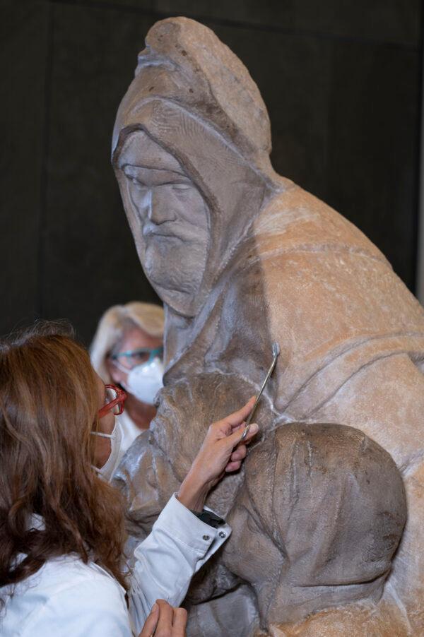 A conservator cleans Nicodemus, who Michelangelo carved in his own image. (Claudio Giovannin/Courtesy of Opera di Santa Maria del Fiore)