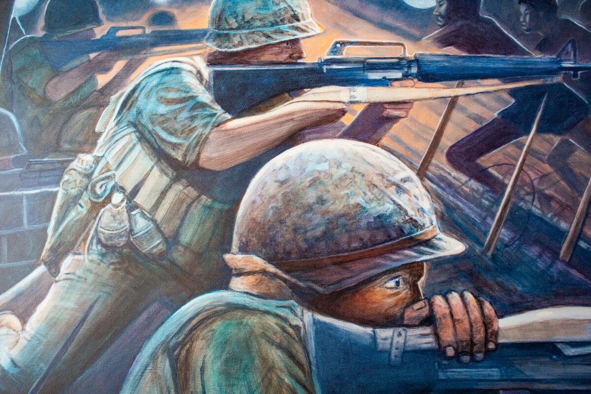 Combat artist Ed Bowen has art he painted during the Vietnam War hanging within his garage in Newport Beach, Calif., on Sept. 14, 2021. (John Fredricks/The Epoch Times)