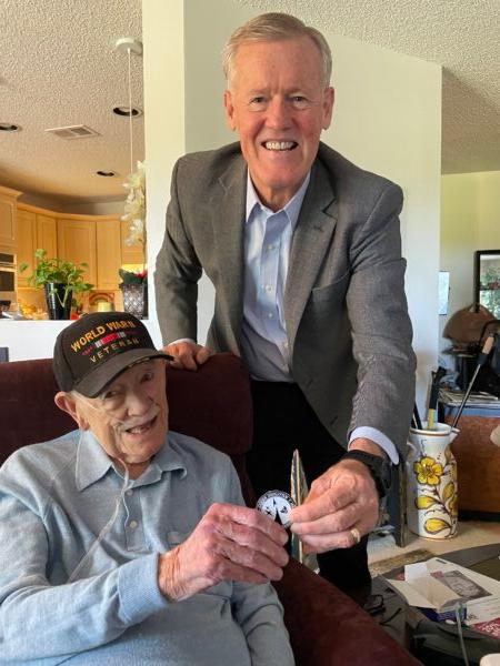Retired USAF Lt. Gen. Wright gives retired Lt. Armand Sedgeley a medallion from the U.S. Air Force Association. (Courtesy of William Sedgeley)
