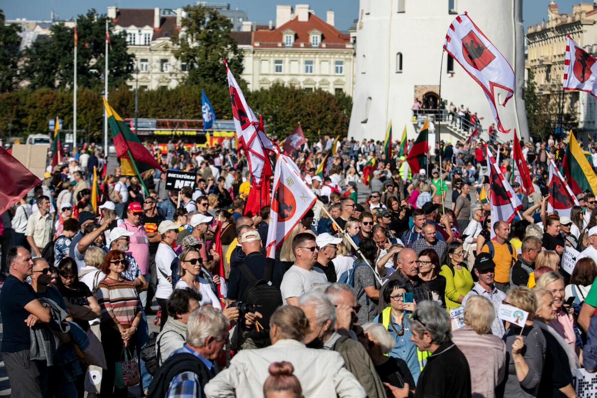 People with flags and banners protesting against COVID-19 policies in Vilnius, Lithuania, on Sept. 10, 2021. (Paulius Peleckis/Getty Images)