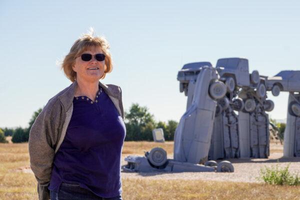 Renee Helmsteadt poses while visiting Carhenge in Alliance, Neb., on Sept. 22, 2021. (Jackson Elliott/Epoch Times)