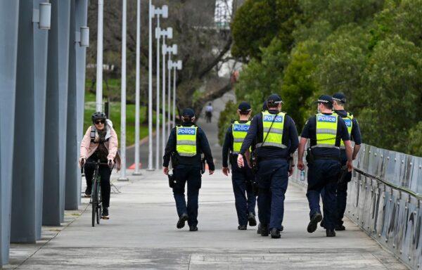 Police patrol the quiet streets of Melbourne, Australia, on Oct. 4, 2021. (William West/AFP via Getty Images)