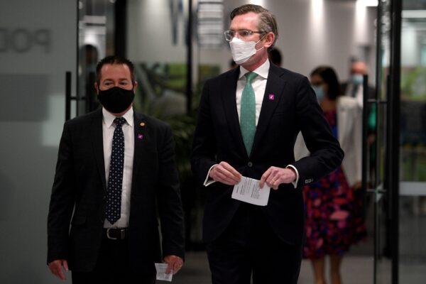 NSW Premier Dominic Perrottet (R) and Deputy Premier Paul Toole arrive to address media during a press conference in Sydney, Australia, on Oct. 7, 2021. (AAP Image/Dan Himbrechts)