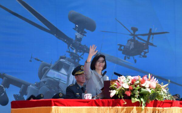 Taiwan's President Tsai Ing-wen waves during a ceremony to commission new U.S.-made Apache AH-64E attack helicopters, at a military base in Taoyuan, Taiwan, on July 17, 2018. (Sam Yeh/AFP)