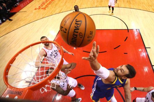 Andrew Bogut, former #12 of the Golden State Warriors, attempts a shot against the Toronto Raptors during Game Two of the 2019 NBA Finals at Scotiabank Arena in Toronto, Canada, on June 02, 2019. (Kyle Terada - Pool/Getty Images)