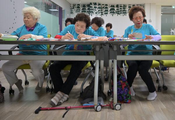 This picture taken on May 14, 2019, shows elderly South Korean women attending a class at a city-run library in Suncheon, south of Seoul. (Jung Yeon-je/AFP via Getty Images)