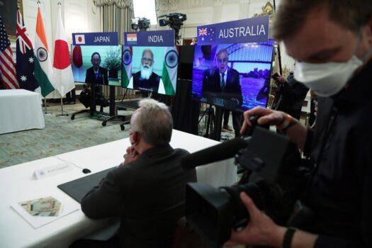 (L–R) Japanese Prime Minister Yoshihide Suga, Indian Prime Minister Narendra Modi, and Australian Prime Minister Scott Morrison participate remotely it a meeting for the leaders of the Quadrilateral Security Dialogue countries, which also includes the United States, at the State Dining Room of the White House in Washington on March 12, 2021. (Getty Images/Alex Wong)