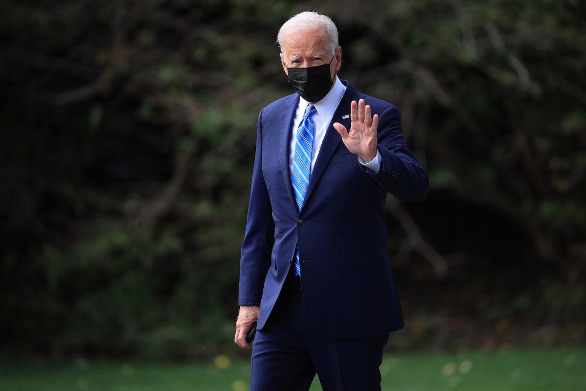 President Joe Biden walks across the South Lawn as he leaves the White House in Washington on Oct. 7, 2021. (Chip Somodevilla/Getty Images)