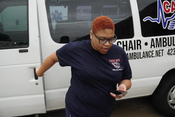Emergency medical responder Chloe Gourley exits a Care Med ambulance in Chattanooga, Tenn., on Oct. 4, 2021. (Jackson Elliott/The Epoch Times)
