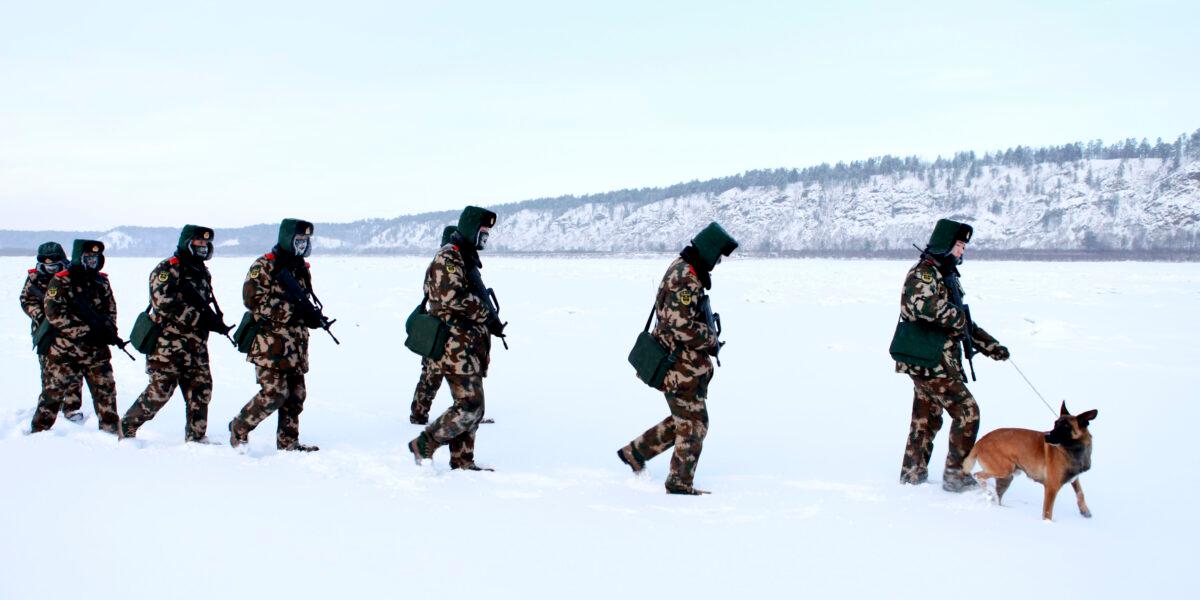Chinese paramilitary police border guards train in the snow at Mohe County in China's northeast Heilongjiang Province, on the border with Russia, on Dec. 12, 2016.<br/>Mohe is the northernmost point in China, with a subarctic climate where border guards operate in temperatures as low as -33 degrees Fahrenheit. (STR/AFP via Getty Images)