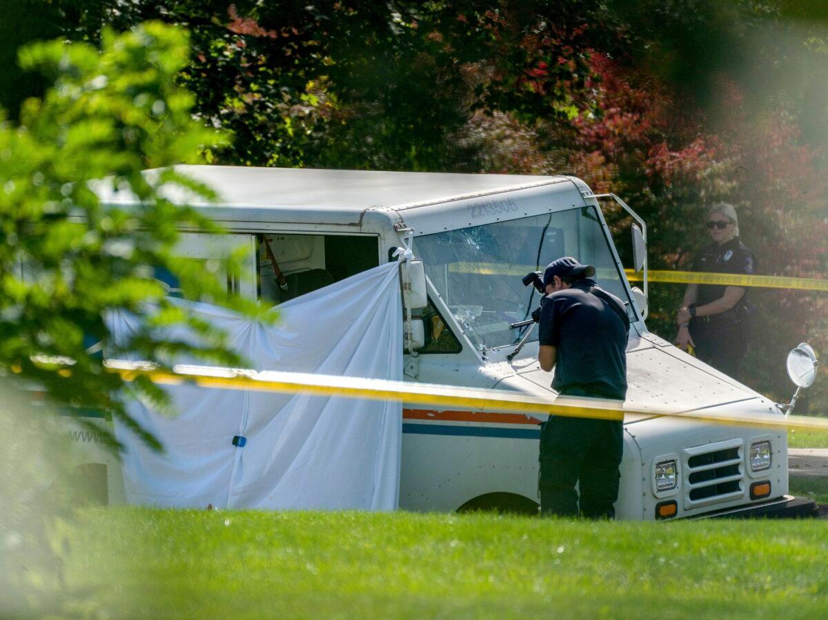Police investigate the scene of a fatal shooting of a postal worker in front of a house on Suburban Ave. in Collier Township, Pa., outside of Pittsburgh, on Oct. 7, 2021. (Andrew Rush/Pittsburgh Post-Gazette via AP)