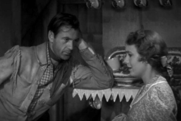 Cole Harden (Gary Cooper, L) being charmed by Jane Ellen (Doris Davenport), in “The Westerner.” (United Artists)