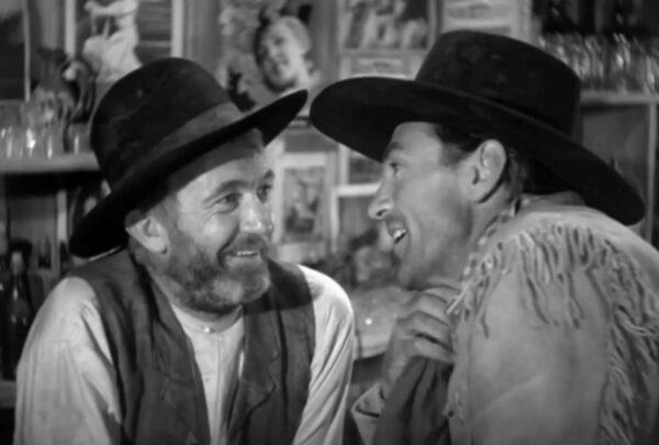 Judge Roy Bean (Walter Brennan, L) and Cole Harden (Gary Cooper) match wits, in “The Westerner.” (United Artists)